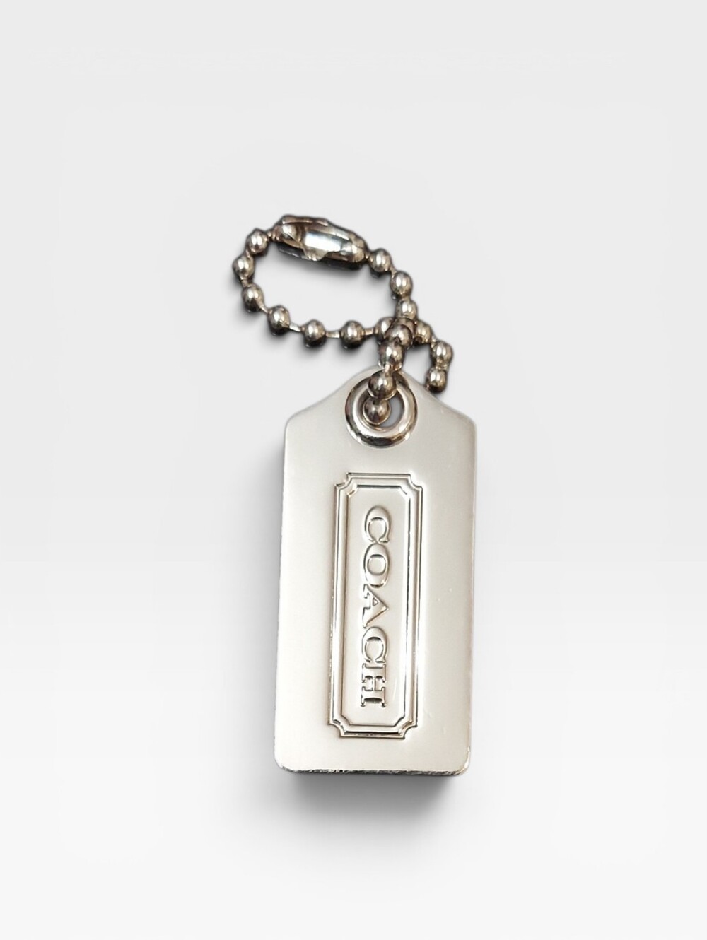 Coach Vintage Metal Hangtag Measures 1.5" X 1" Aprox.